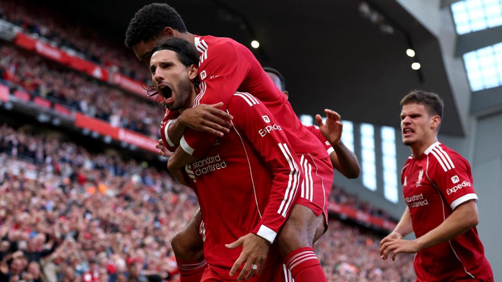 Liverpool go top after edging Arsenal at Anfield